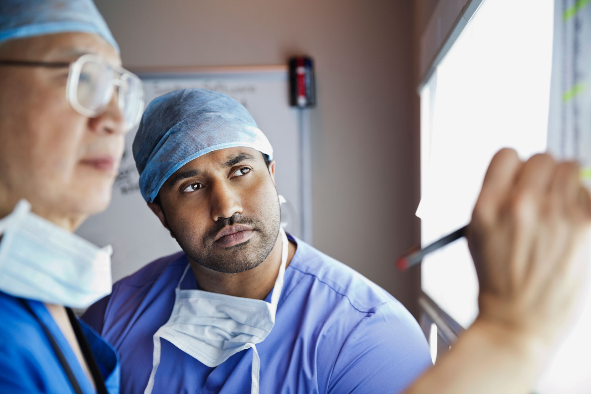 Two doctors looking over an x-ray Two doctors looking over an x-ray