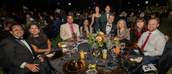 Gala attendees sitting around table.